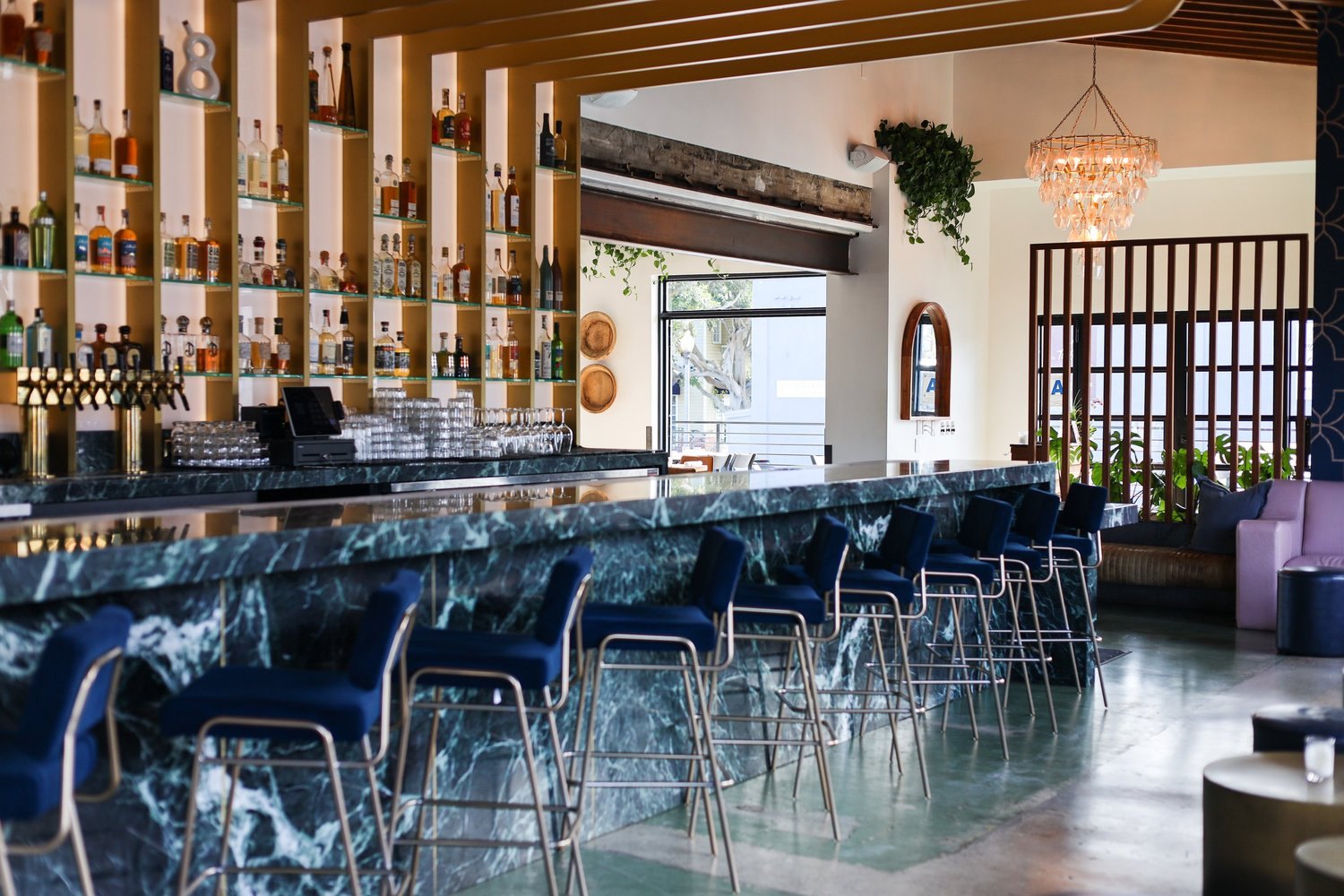 The Havana Lounge bar at Fresco Cocina — green marble and sapphire stools